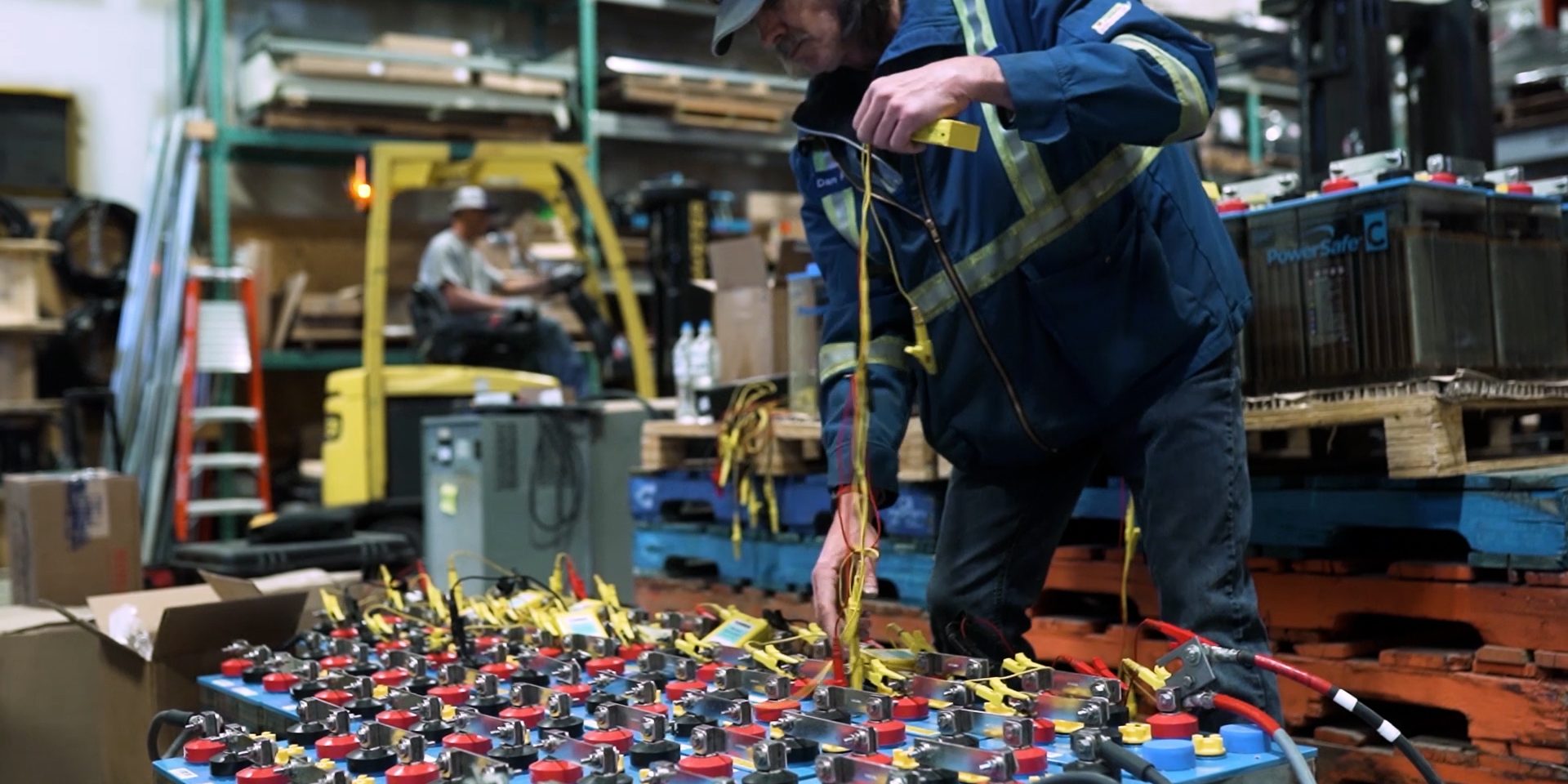 Battery Electric worker working with wires