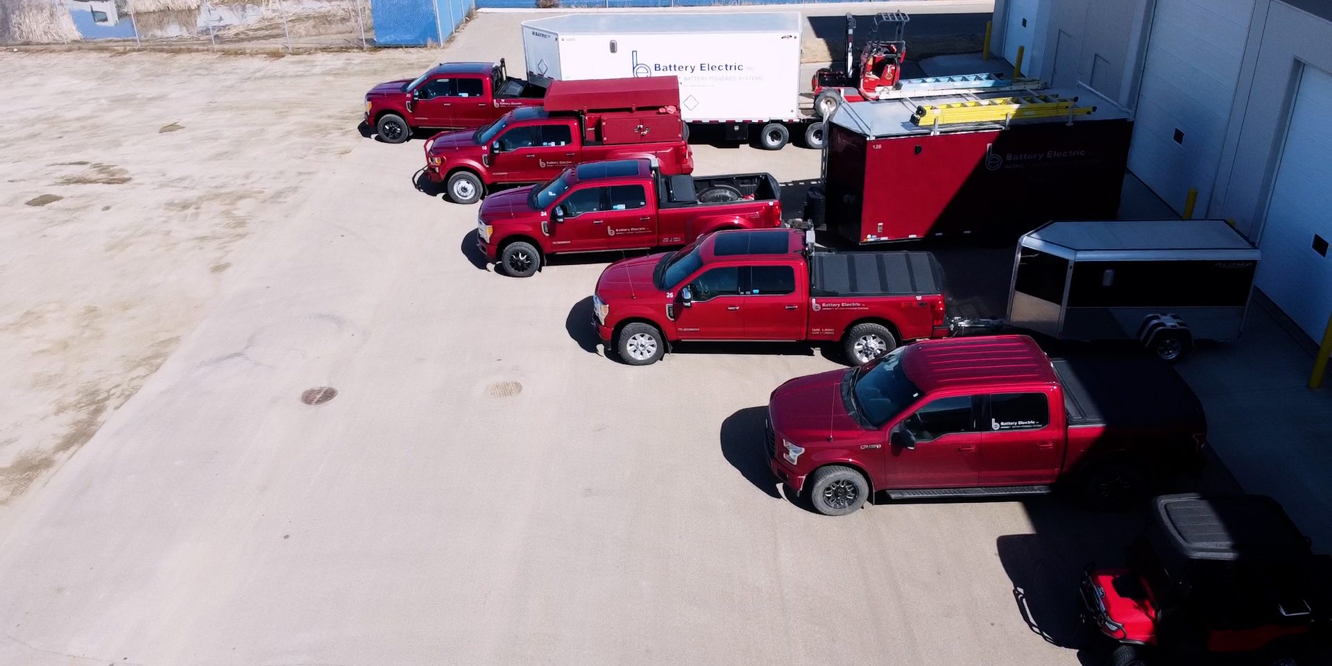 battery electric trucks with trailers outside